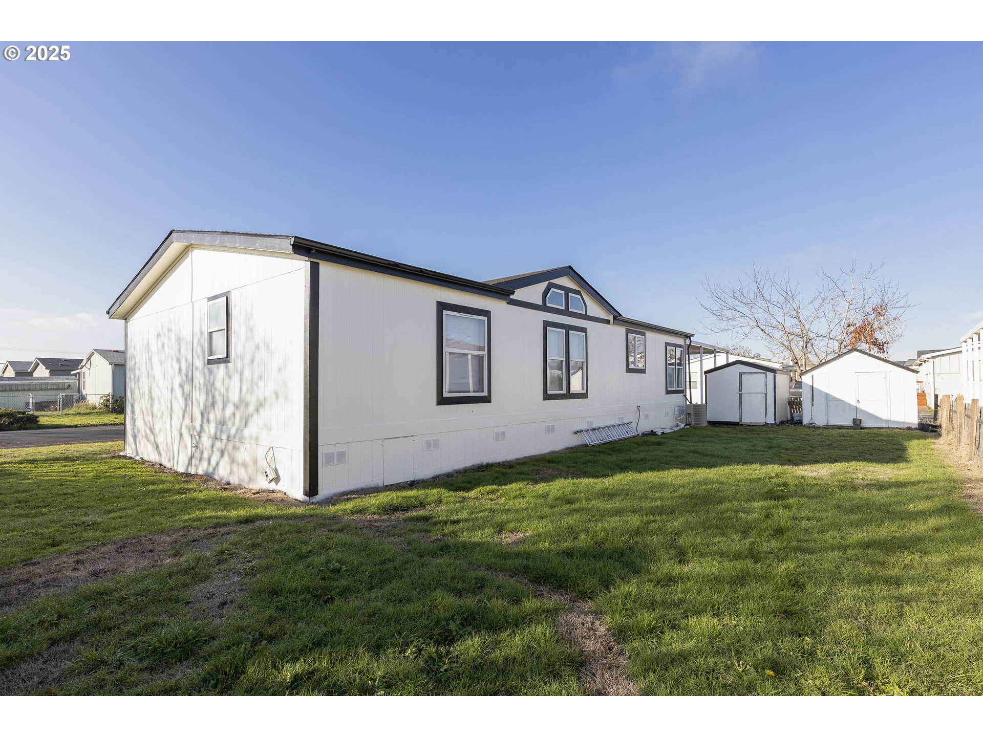 911 York Street, Unit 82 Aumsville, OR 97325 - Photo 23 of 26 a front view of a house with a yard