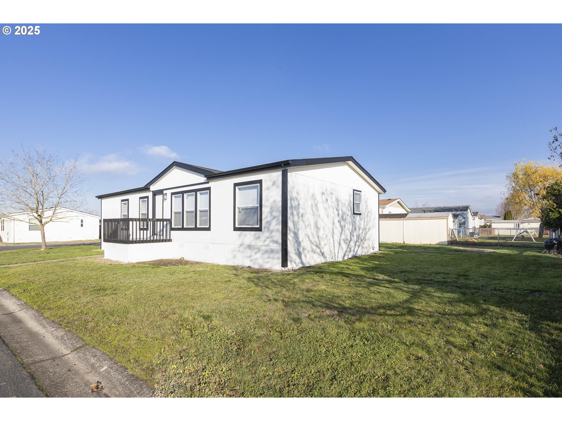 911 York Street, Unit 82 Aumsville, OR 97325 - Photo 4 of 26 a view of a house with yard and deck