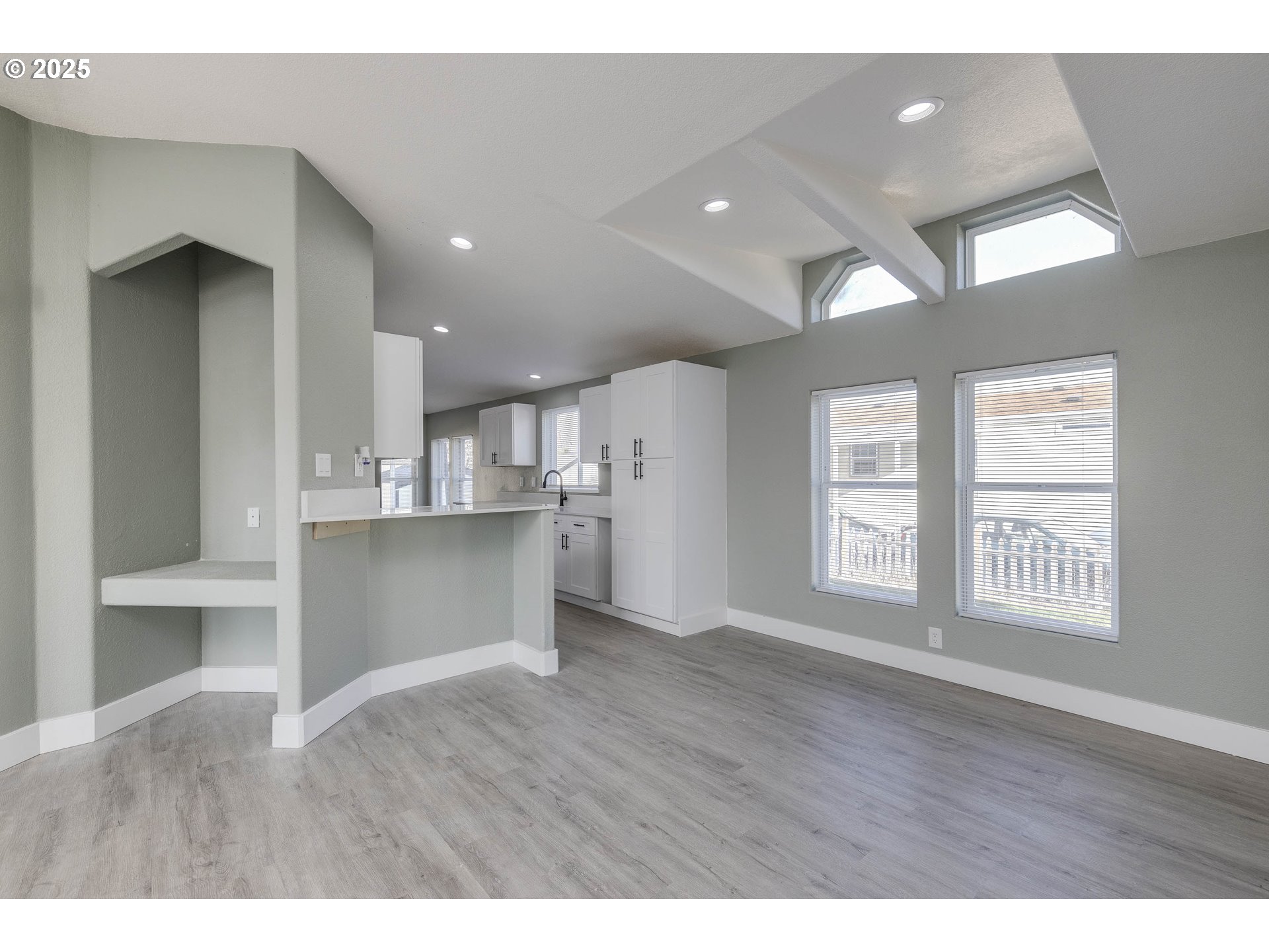 911 York Street, Unit 82 Aumsville, OR 97325 - Photo 7 of 26 a view of an empty room with wooden floor and a window
