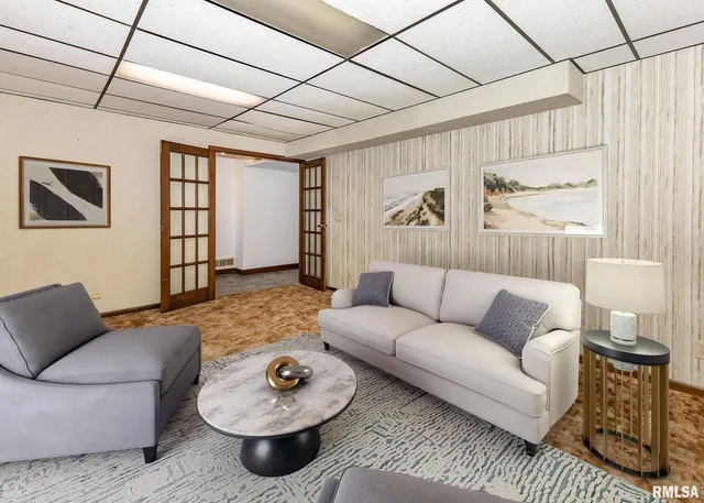 a living room with furniture and a rug