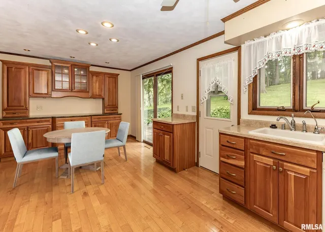 a spacious bathroom with a granite countertop sink and a large mirror