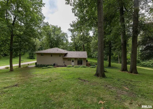 a house with a tree in front of it