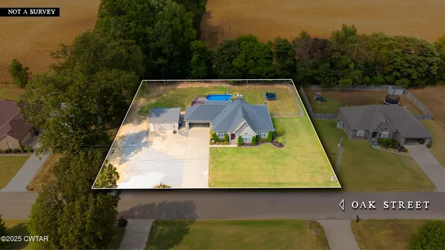 swimming pool view with a garden