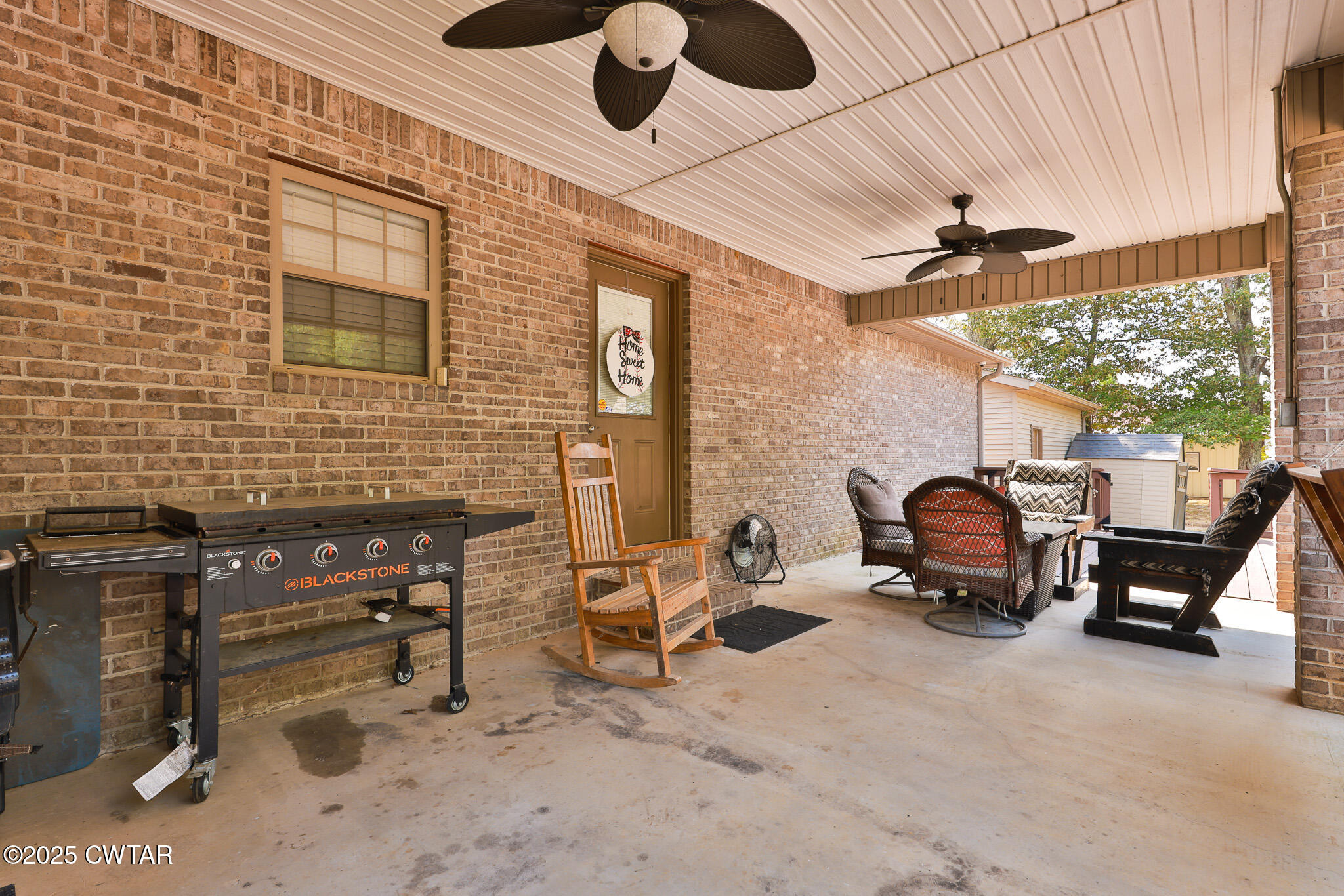 141 Oak Street Martin, TN 38237 - Photo 11 of 30 a backyard of a house with seating space