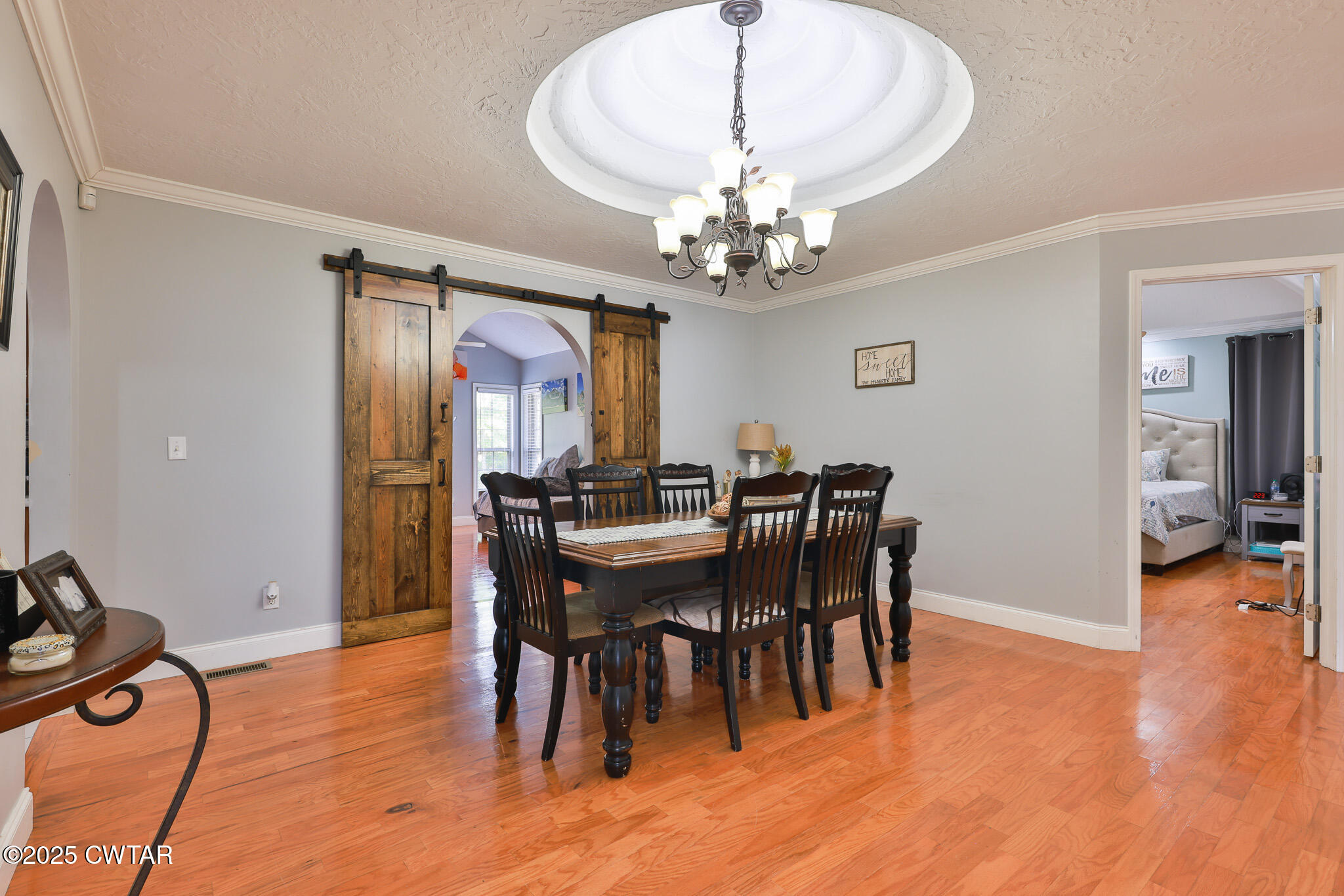 141 Oak Street Martin, TN 38237 - Photo 14 of 30 a view of a dining room with furniture wooden floor and chandelier