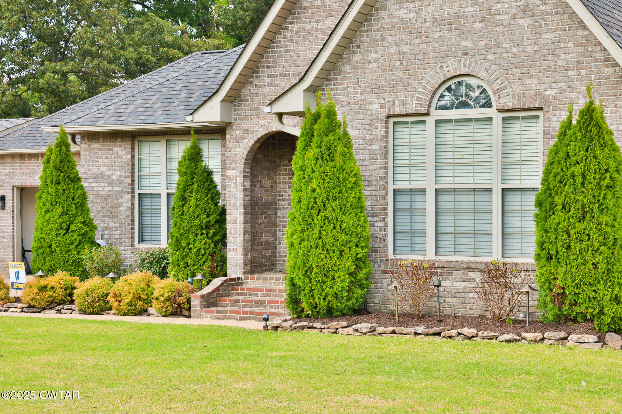 141 Oak Street Martin, TN 38237 - Photo 5 of 30 a front view of a house with a yard
