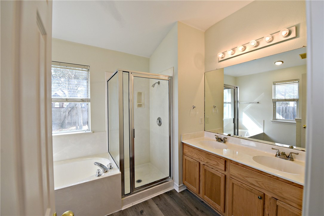 3665 Spring Canyon Trail Round Rock, TX 78681 - Photo 13 of 21 a bathroom with a double vanity sink mirror double and shower