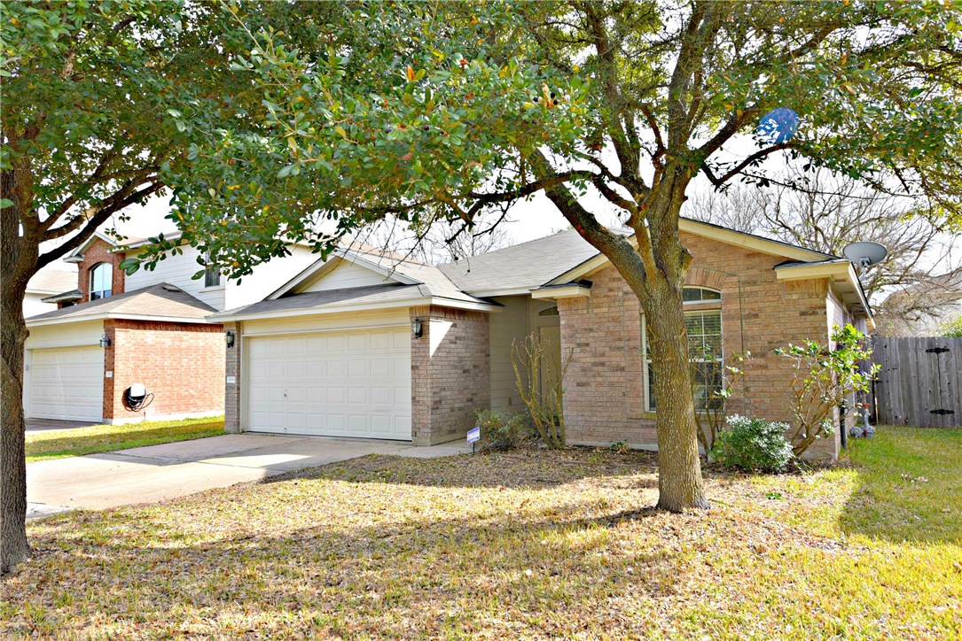 3665 Spring Canyon Trail Round Rock, TX 78681 - Photo 3 of 21 a front view of a house with a yard