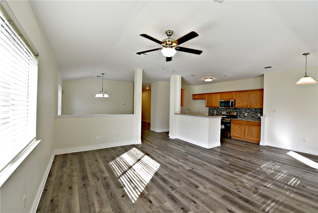3665 Spring Canyon Trail Round Rock, TX 78681 - Photo 7 of 21 a view of empty room with wooden floor and window