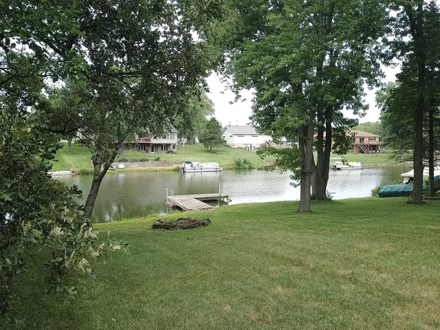 a view of a lake in a backyard