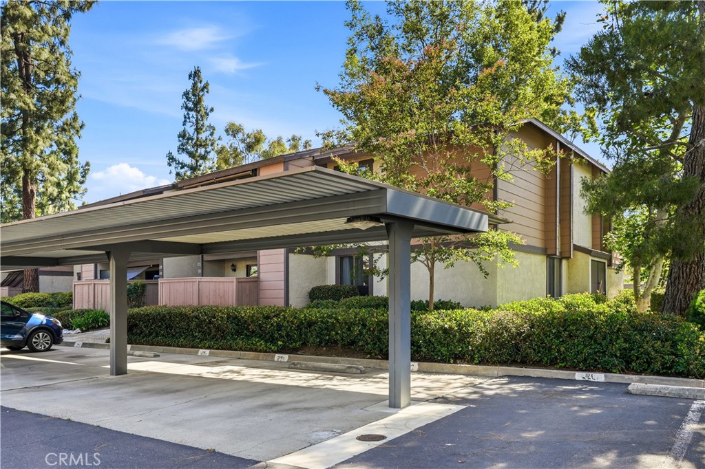 20702 El Toro Road, Unit 231 Lake Forest, CA 92630 - Photo 30 of 36 a front view of a house with a yard