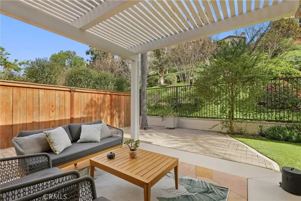 a outdoor living space with furniture and a potted plant