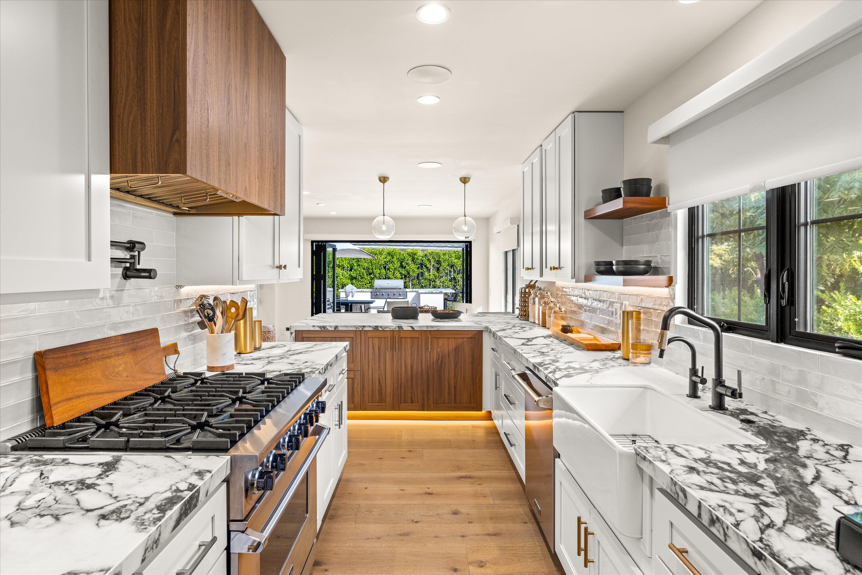 516 Mills Way Goleta, CA 93117 - Photo 11 of 38 a kitchen with stainless steel appliances granite countertop a sink stove and refrigerator