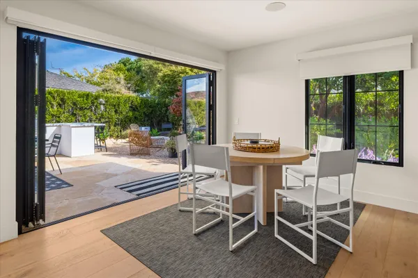 a view of a dining room with furniture window and outside view