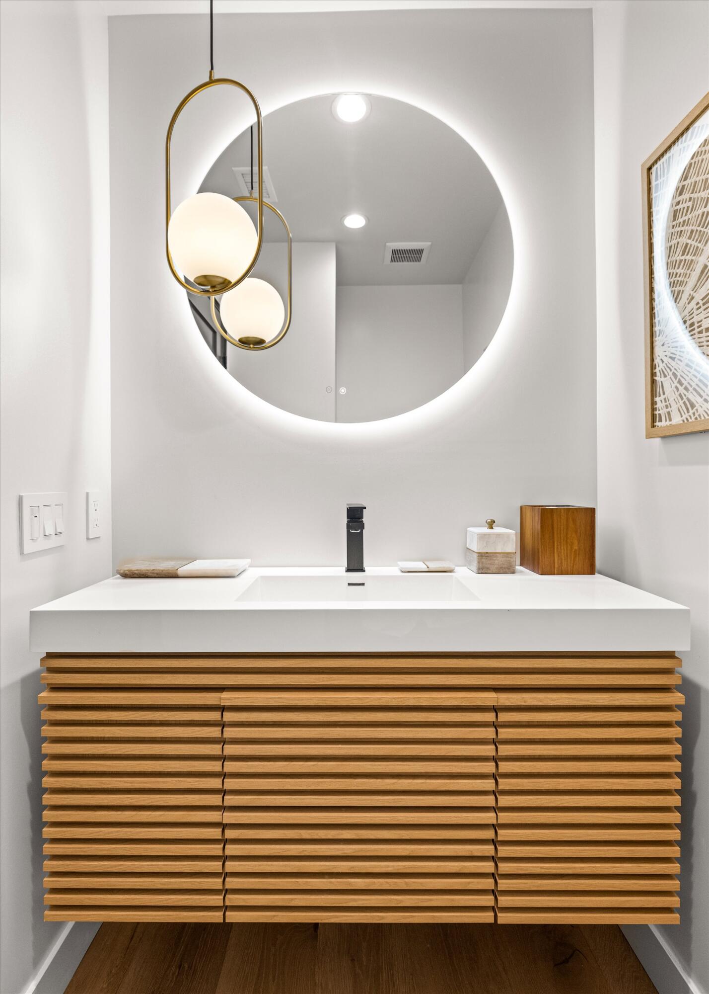516 Mills Way Goleta, CA 93117 - Photo 24 of 38 a bathroom with a sink and a mirror