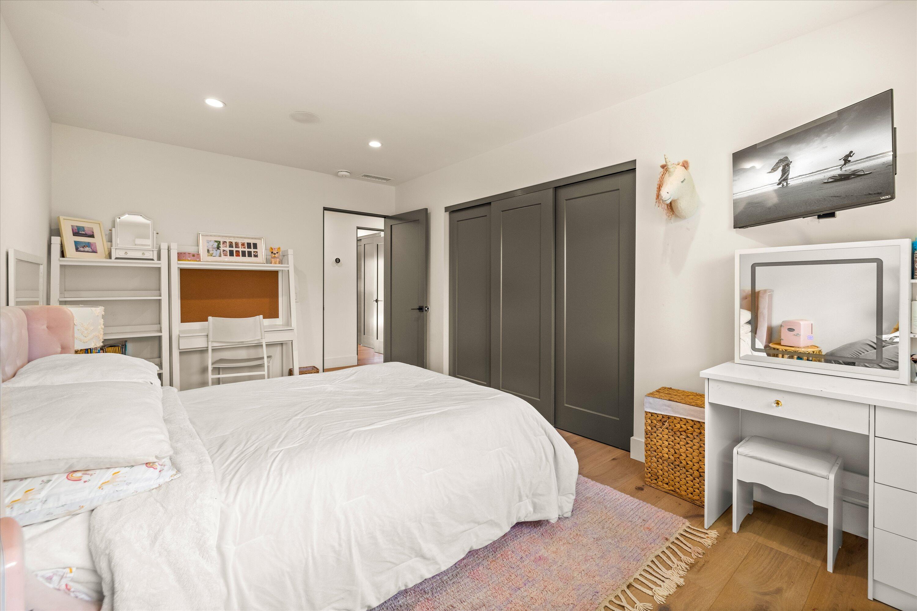 516 Mills Way Goleta, CA 93117 - Photo 27 of 38 a spacious bedroom with a bed and a desk