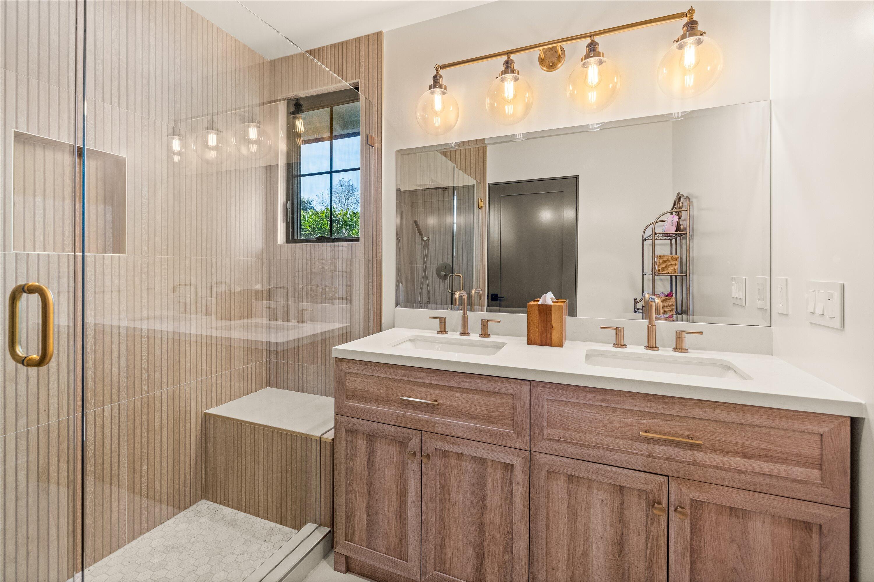 516 Mills Way Goleta, CA 93117 - Photo 30 of 38 a bathroom with a double vanity sink and a mirror