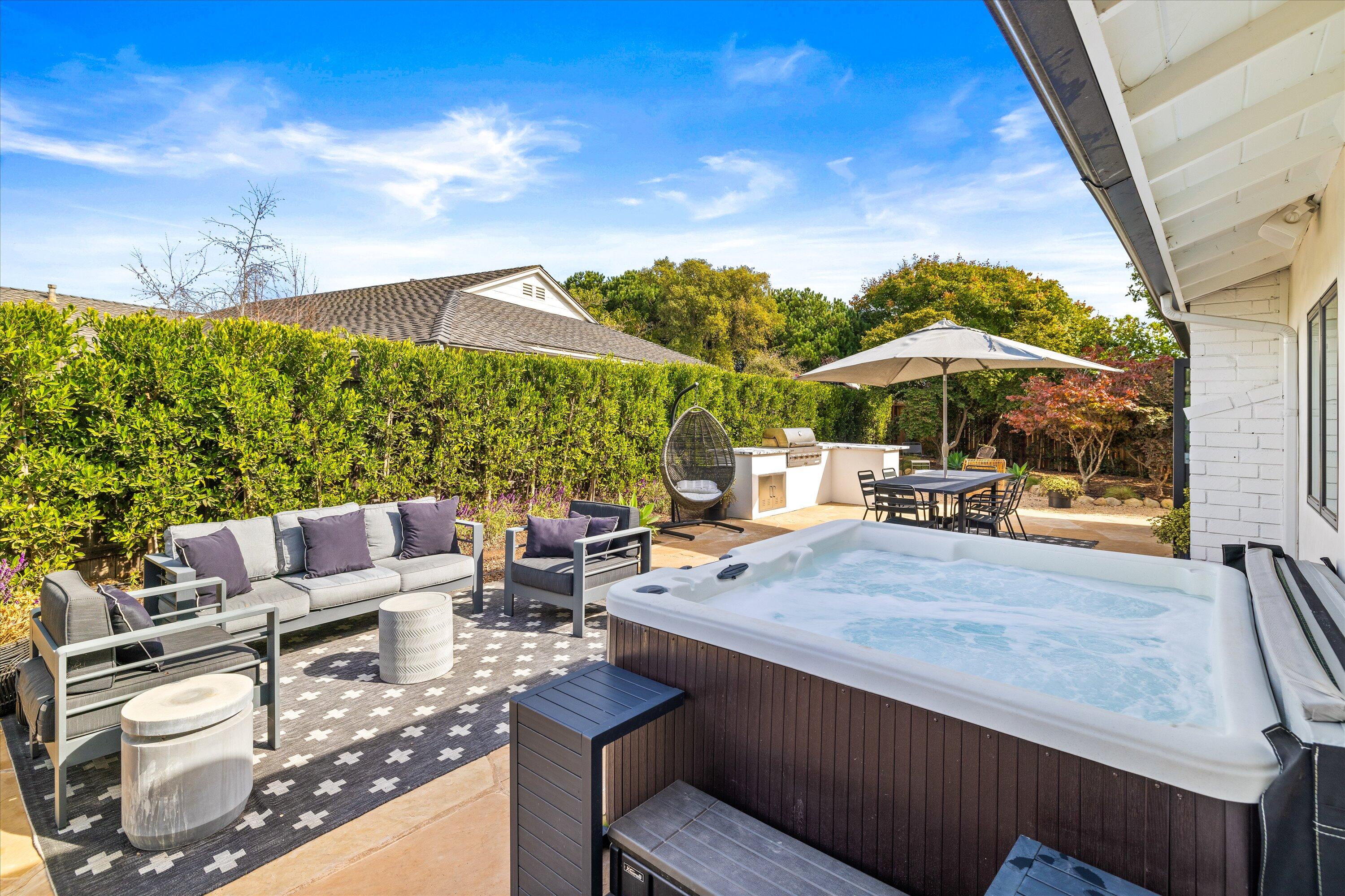 516 Mills Way Goleta, CA 93117 - Photo 37 of 38 a view of patio with chairs and table under an umbrella with a barbeque
