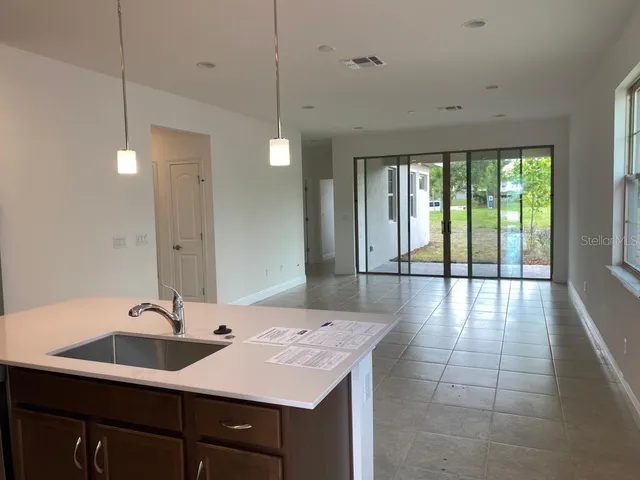 a en suite bathroom with a sink and a large mirror