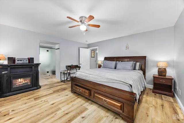 a bedroom with a bed and a fireplace