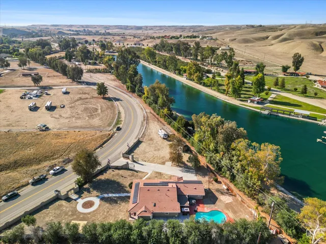 an aerial view of a house with a ocean view