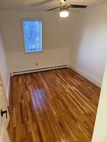 a front view of house with car parked