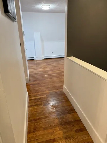 a kitchen with stainless steel appliances a refrigerator and a stove top oven