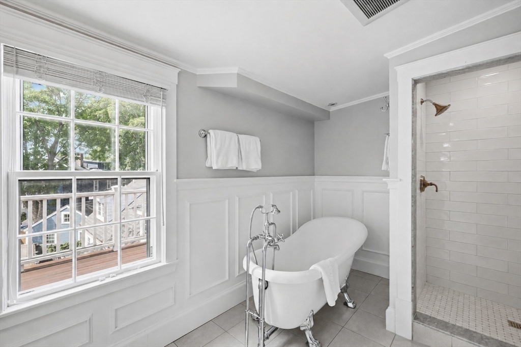 33 Franklin Street Marblehead, MA 01945 - Photo 34 of 42 a hallway with a table and a chair