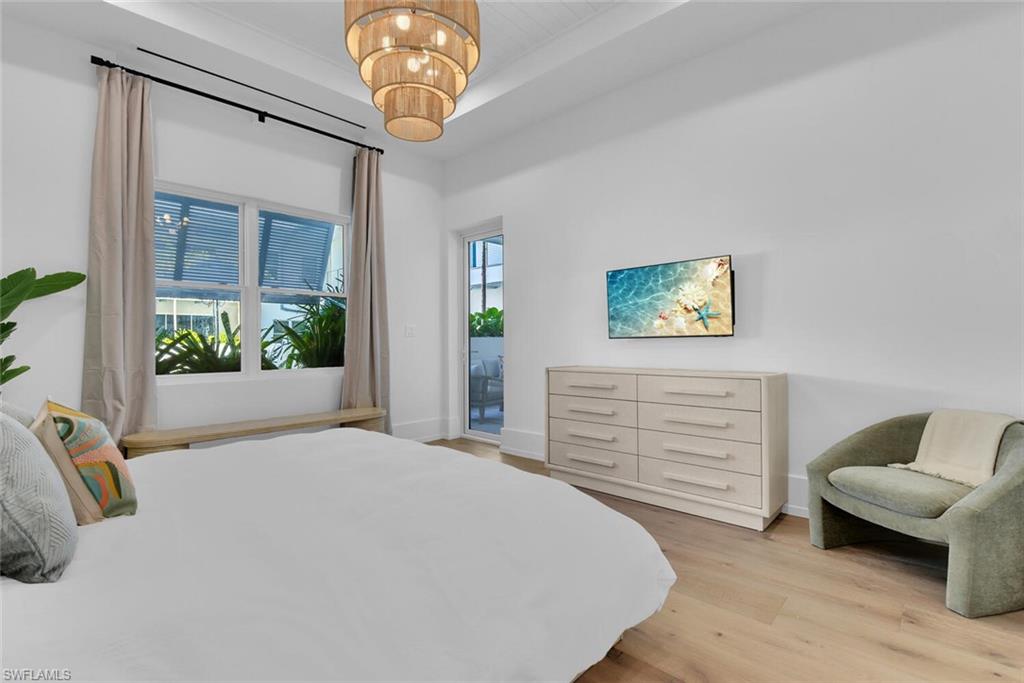 201 8th Street South, Unit 209 Naples, FL 34102 - Photo 15 of 41 a bedroom with a bed and a window