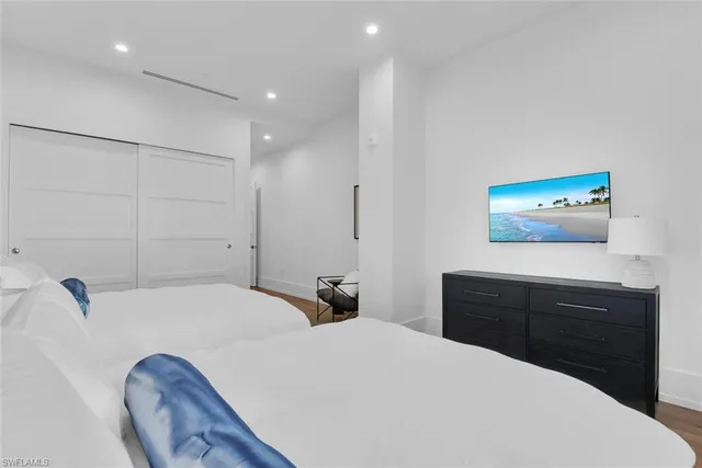 a bedroom with a bed and a dresser