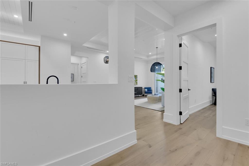 201 8th Street South, Unit 209 Naples, FL 34102 - Photo 2 of 41 a view of a living room and chandelier