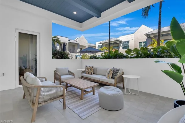 a outdoor living space with furniture and city view