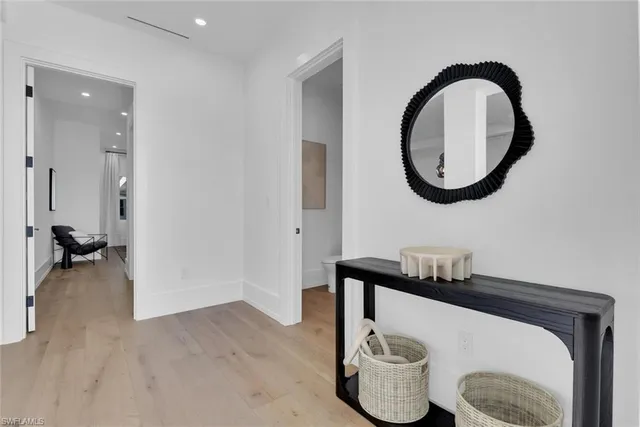 a bathroom with a toilet a sink and a mirror