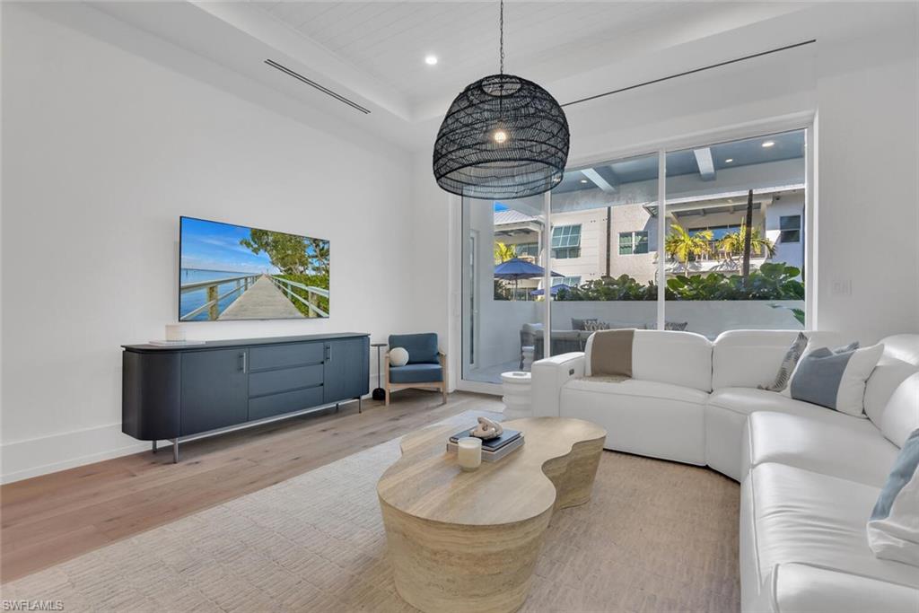 201 8th Street South, Unit 209 Naples, FL 34102 - Photo 5 of 41 a living room with furniture