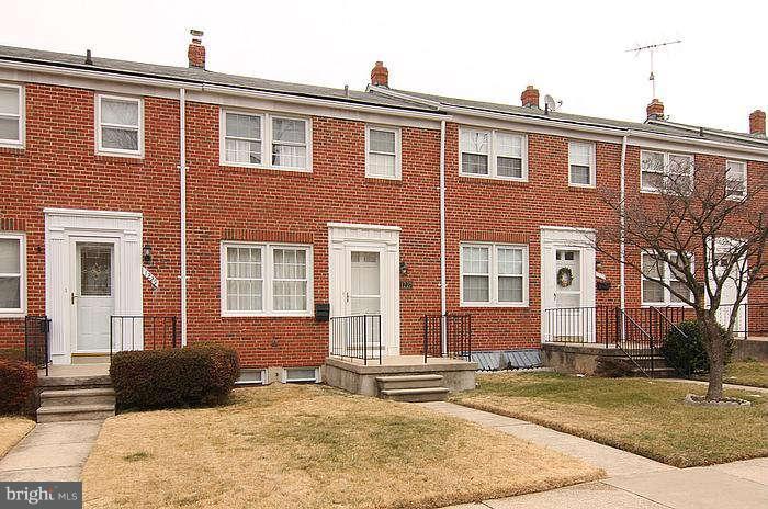 1227 Newfield Road Baltimore, MD 21207 - Photo 1 of 16 a front view of a house