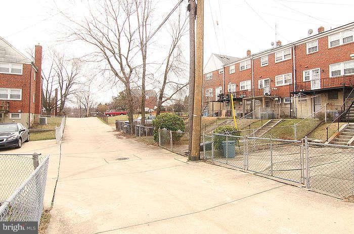1227 Newfield Road Baltimore, MD 21207 - Photo 15 of 16 a view of a swimming pool with a lounge chair
