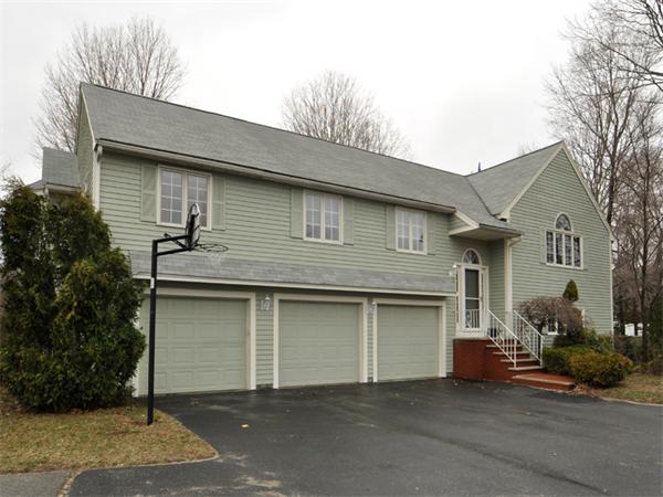 7 Landers Road Stoneham, MA 02180 - Photo 1 of 1 a front view of a house with garage