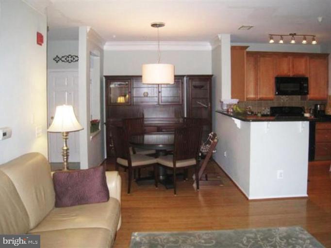1601 Spring Gate Dr., Unit 1214 McLean, VA 22102 - Photo 16 of 16 Open floorplan with tall ceilings and kitchen bar