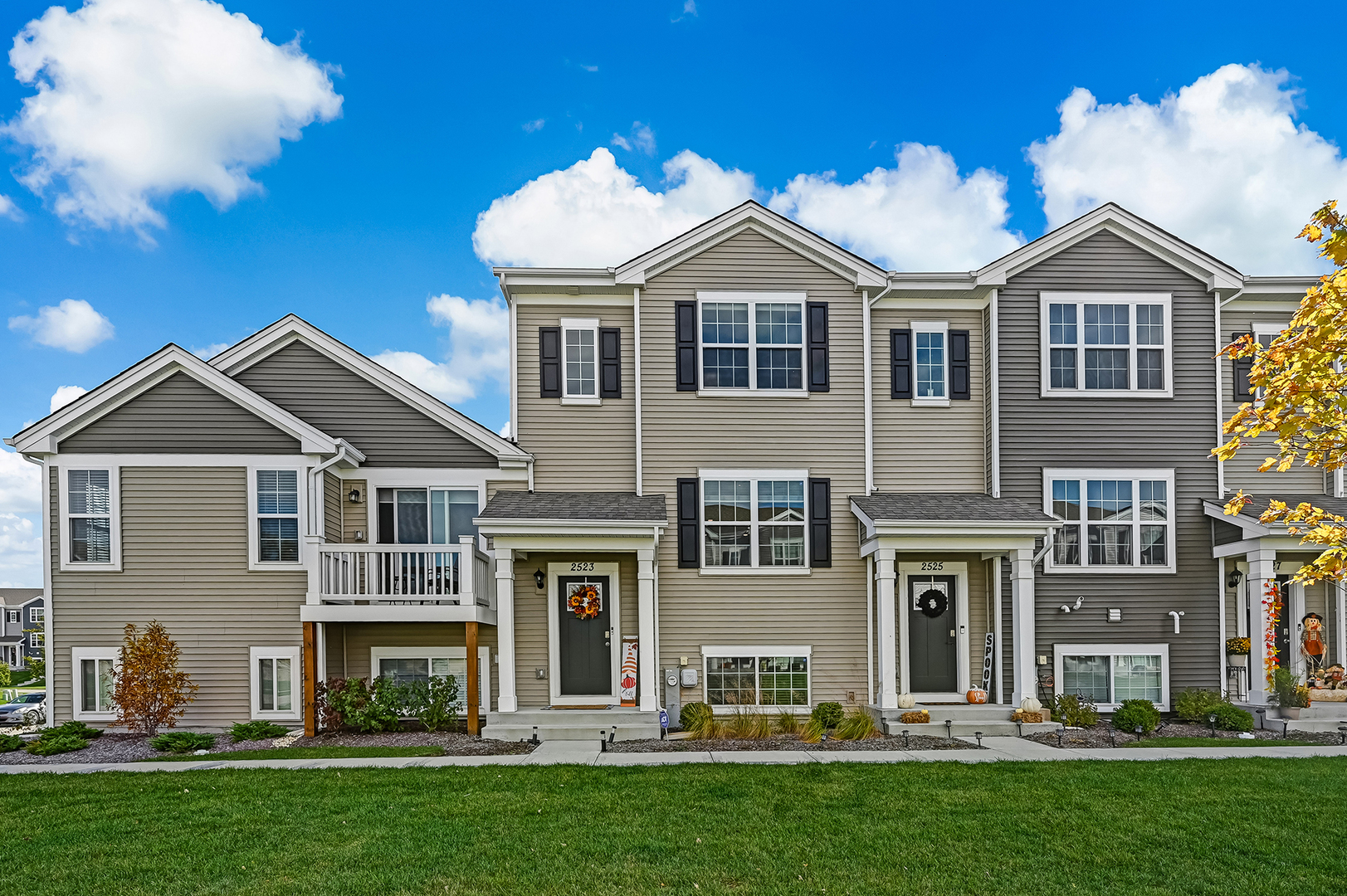 a front view of a house with a yard