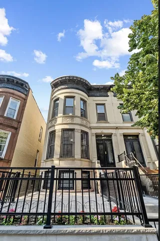 a bathroom with a granite countertop toilet a sink and a mirror