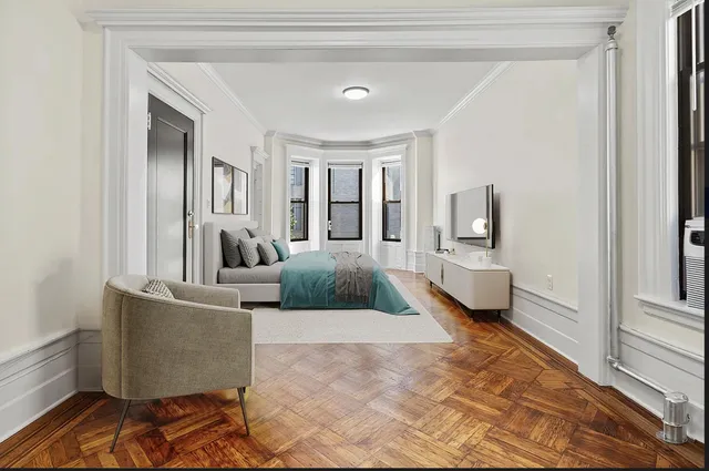 a living room with furniture wooden floor and a chandelier