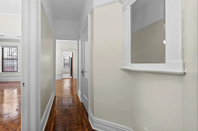 a spacious bedroom with a bed and a window