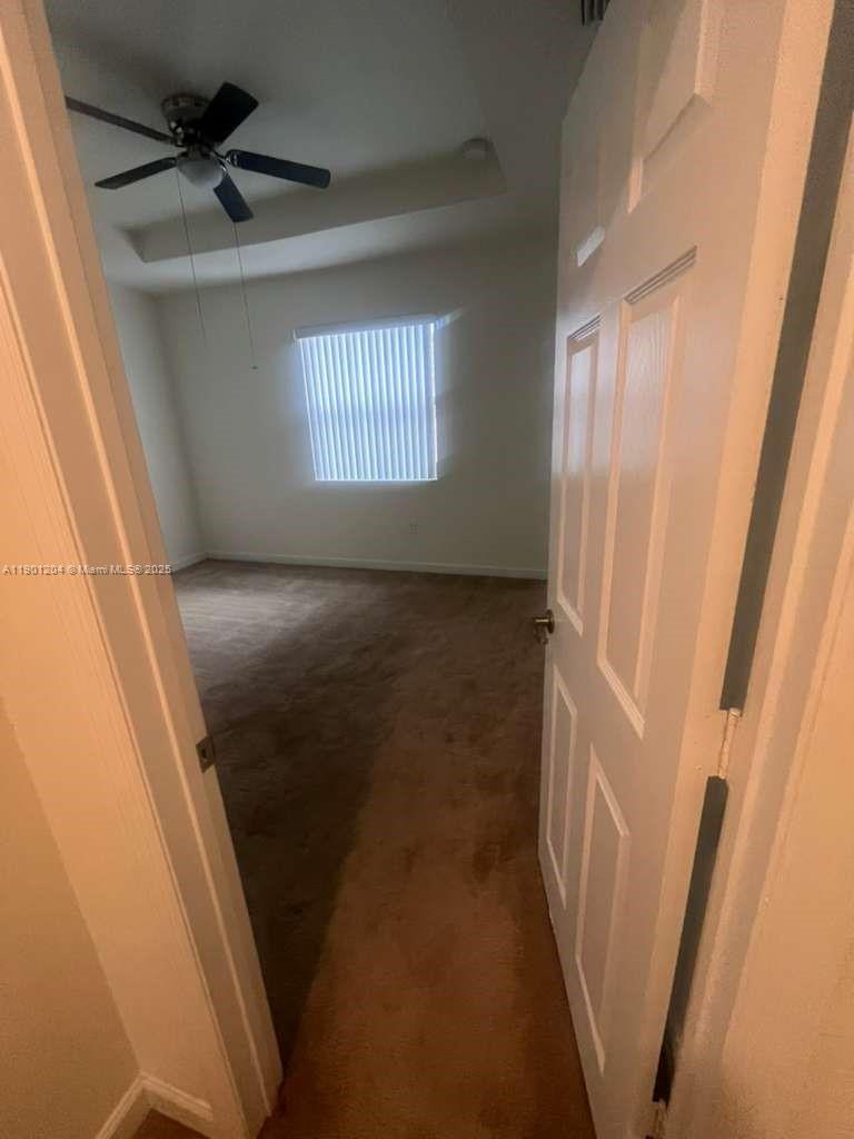 11481 Southwest 250th Street, Unit 11481 Homestead, FL 33032 - Photo 8 of 12 a view of an empty room