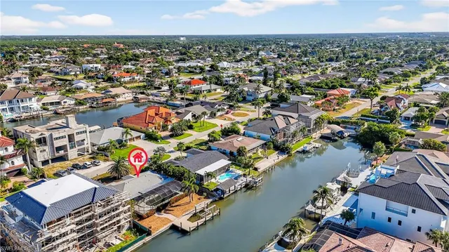 an aerial view of a city with parking