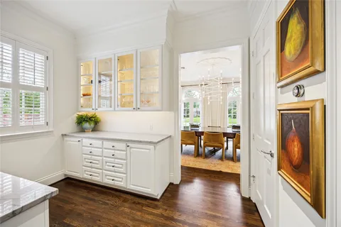 a living room with wooden floors and a window