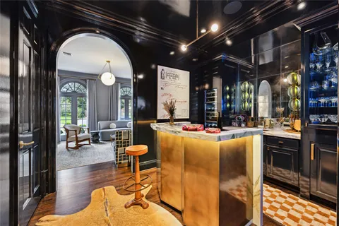 a living room with fireplace furniture and a large window