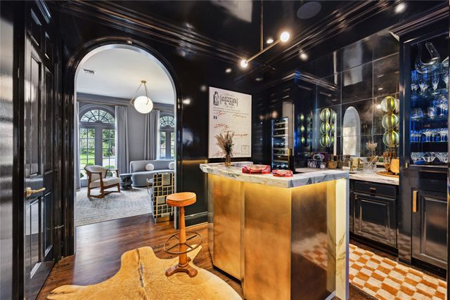 a living room with fireplace furniture and a large window