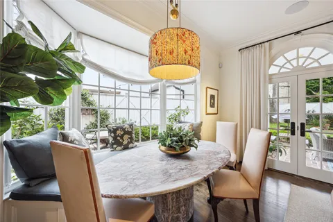 a dining room with furniture a livingroom and chandelier