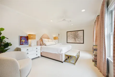 a bedroom with a bed and a couch