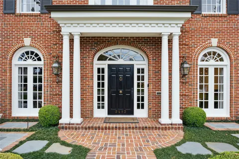 a front view of a building with garden
